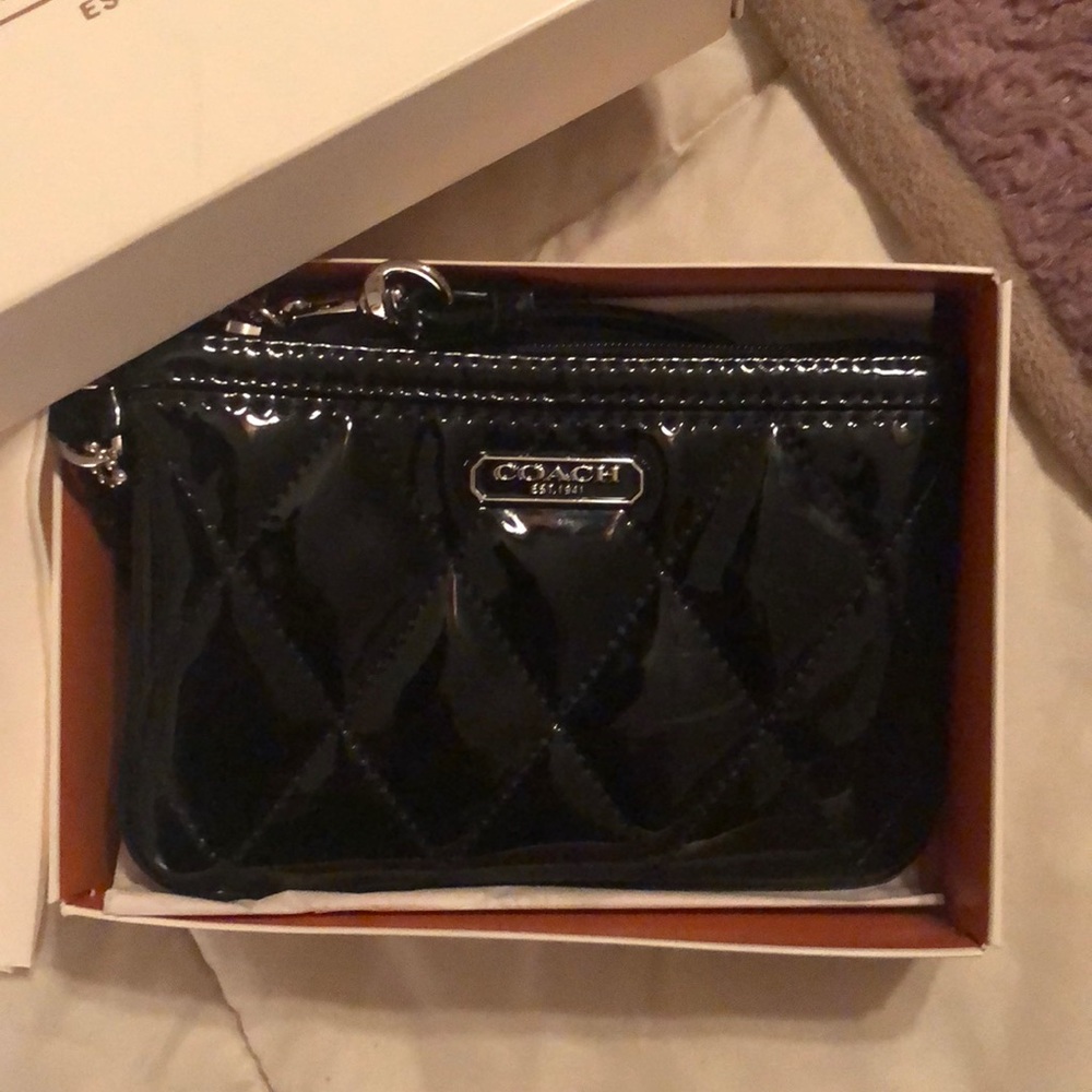 Shiny black Coach clutch